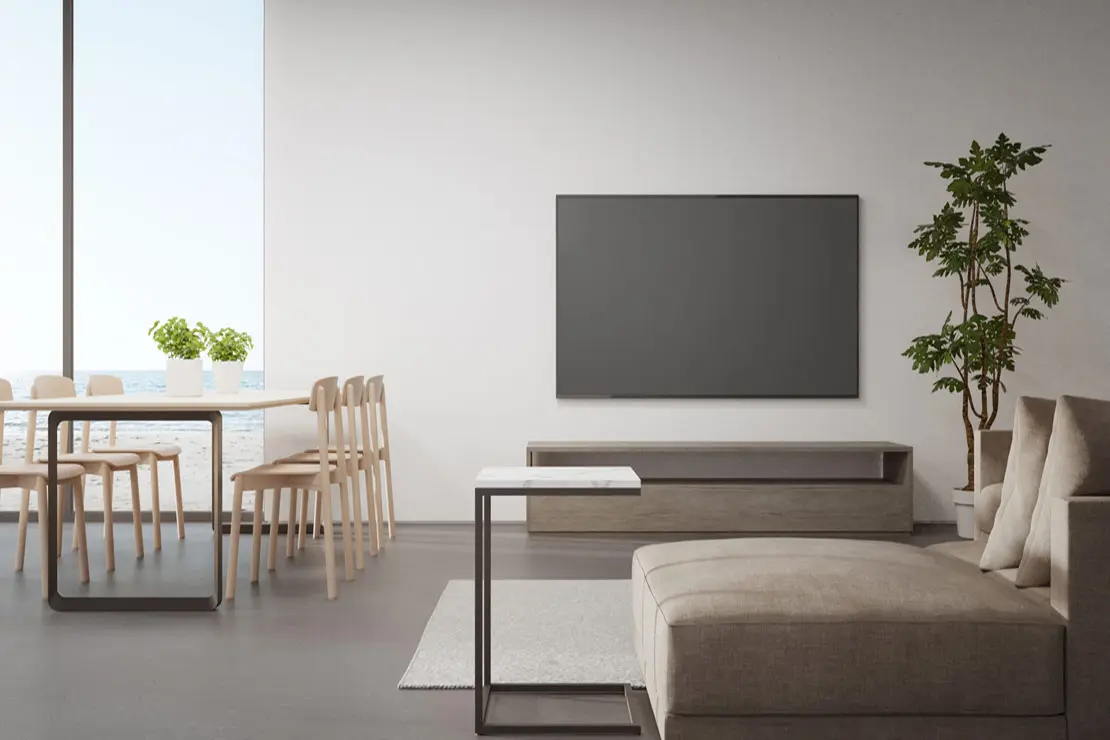 Estancia con piso de microcemento de tono grisáceo.